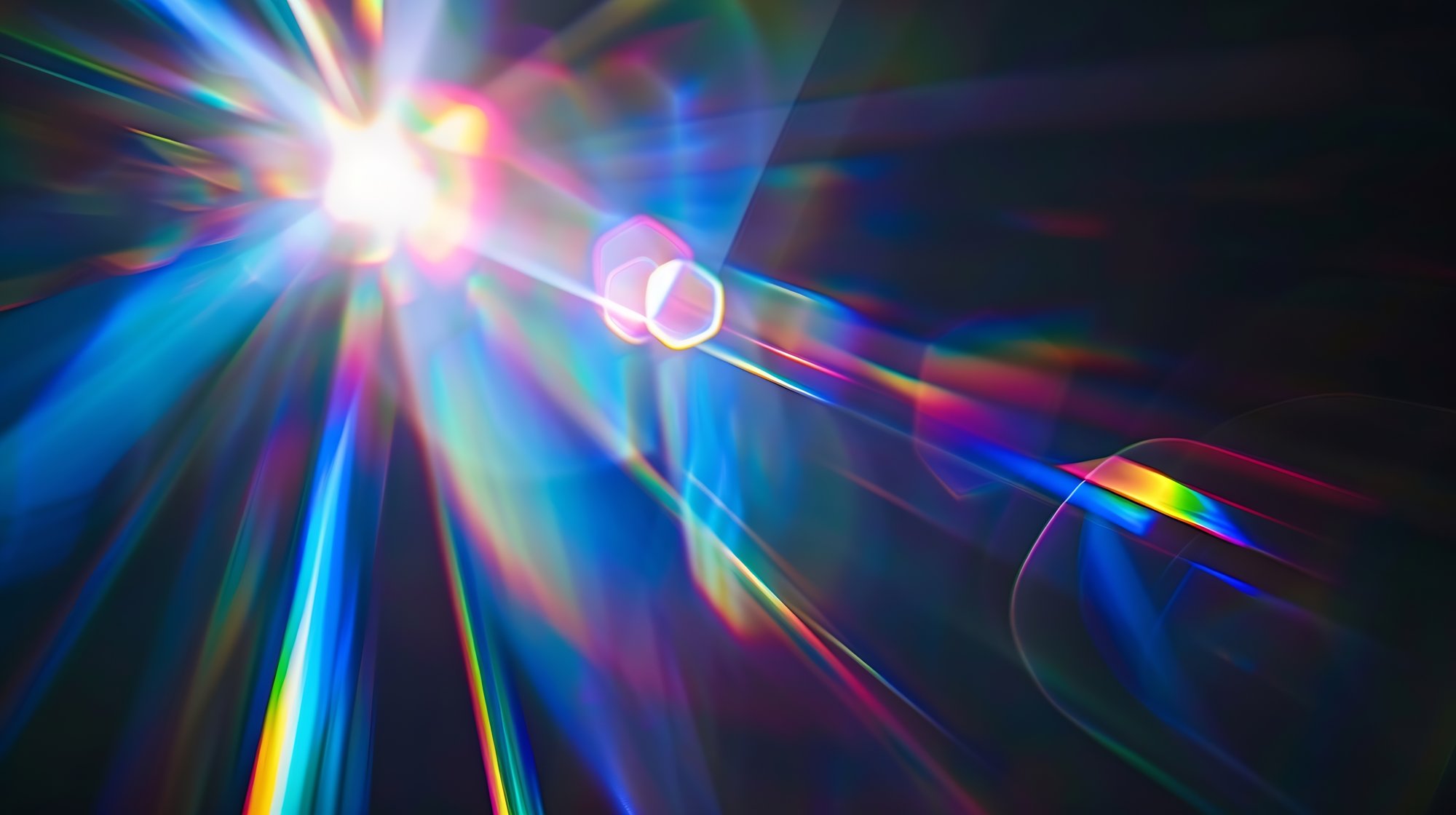 Colored light streams through darkness
